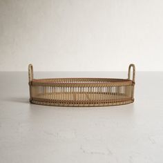 a wicker basket sitting on top of a white counter