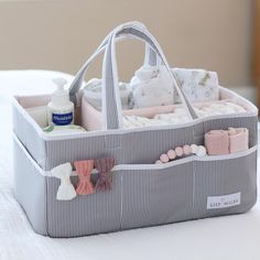 the diaper caddy is filled with baby items