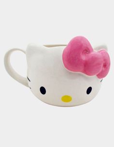 a hello kitty coffee cup with a pink bow on it's head and eyes