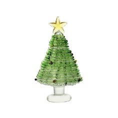 a green glass christmas tree with a star on top