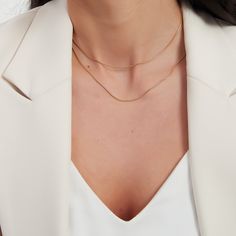 Double gold snake chain necklace. This necklace is a two layers set. The set has one short and one long snake chain. It is your go to every-day necklace. A perfect addition to your jewelry collection! ………………………………….D E T A I L S• Materials: Stainless steel, 18k gold plating.• Length: long chain: 15 inches (38 cm), short chain: 14 inches (35 cm) + extension 2 inches (5 cm)• This product is hypoallergenic, water and tarnish resistant Dainty Layered Snake Chain Necklace, Double Snake Chain Necklace For Layering, Minimalist Snake Chain Necklaces For Layering, Double Chain Snake Necklace For Layering, Snake Chain Necklace With Double Chain For Layering, Elegant Gold Snake Chain Layered Necklace, Minimalist Layered Necklace With Clavicle Chain, Elegant Double Chain Snake Necklace For Layering, Elegant Double Chain Layered Snake Necklace