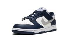 The Nike Dunk Low “Navy/White/Grey” is a classic and versatile colorway of the vintage basketball shoe that shows love to a popular, non-original Air Jordan 1 style.  The shoe in question is the Jordan 1 High OG “Midnight Navy” that originally debuted as part of Jordan Brand and Nike’s former Japan-only “Concept Japan” or Co. Jo collection.  Like the “Midnight Navy,” the “Navy/White/Grey” features a white leather base with contrasting navy leather overlays and a grey Swoosh.  As for the rest of Sneaker Displays, Original Air Jordans, Kobe Shoes, Sneakers Box, Navy Blue Shoes, Blue Jordans, Grey Nikes, Pretty Shoes Sneakers, Cute Nike Shoes