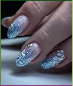 This captivating design draws inspiration from a serene winter night. A gradient of deep blue and white, adorned with delicate swirls and specks of silver glitter, evokes the image of snow gently falling on a quiet evening. Photo credit by: https://pin.it/5B8yjYevZ