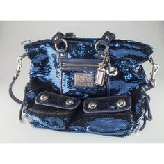 Coach Poppy Blue Sequin Spotlight Purse w/ Disco Ball Bag Charm XL Gorgeous Sequin Poppy Purse by Coach Features a Number of Silver Elements, a Tag Zipper, and a Disco Ball Bag Charm 12" Wide 13" Long 3" Deep Overall purse is in good condition. Some minor wear on leather elements and other minor signs of use on interior. See photos for details. Reference Item #A07122204C JP 12/16/22 Louis Vuitton Key Holder, Coach Bags Outlet, Cheap Coach Bags, Coach Tote Bags, Coach Poppy, Black Leather Tote Bag, Denim Tote Bags, Popular Bags, Coach Shoulder Bag