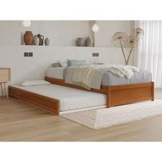 a bed sitting on top of a hard wood floor