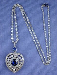 Edwardian Vintage Genuine diamond blue sapphire long chain heart necklace in sterling silver for women  Metal Purity:925 ⁵ Metal weight: 90.00 gram Stone : Rose cut diamond Stone  Clarity: SI1-SI2 stone Ctw: 20..90ctw Gemstone: Blue sapphire  Gemstone creation: lab created  Item length: 20. 00 inch Item finished in 18k white gold plated on silver Luxury Blue Heart Pendant Jewelry, Exquisite Sapphire Diamond Necklace, Formal Sapphire Heart Necklace, Blue Heart Cut Necklace For Formal Occasions, Formal Heart-shaped Sapphire Jewelry, Elegant Sapphire Heart Pendant Necklace, Sapphire Necklace For Anniversary, Elegant Blue Necklace With Single Cut Diamonds, Anniversary Sapphire Pendant Diamond Necklace