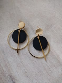 Gold and black statement earrings made of very lightweight metal and genuine leather. Black Minimalist Jewelry For Everyday, Minimalist Black Leather Jewelry, Black Minimalist Metal Earrings, Chic Black Dangle Earrings, Black Faux Leather Trendy Jewelry, Trendy Black Faux Leather Jewelry, Elegant Faux Leather Jewelry For Party, Chic Black Leather Jewelry, Chic Black Earrings With Black Enamel