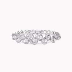 Pear shape, round, and openwork pavé diamonds tell a story of nature’s beauty within this Peony diamond bracelet. Each arrangement of stones represents the petals of a peony flower as it blooms with romantic elegance. This captivating white gold and diamond bracelet forms part of our Classic Graff collection, timeless jewels that celebrate our reputation for the world’s most exquisite diamonds. A timeless Peony diamond bracelet with a total approximate weight of 7.26 carats. Dream Board Quotes, Graff Jewelry, Diamond Shaped Engagement Ring, Gold And Diamond Bracelet, Rare Diamonds, Graff Diamonds, Chic Ootd, Round Diamond Pendant, Diamond Earrings Studs Round