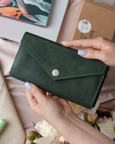 A lovely, deep green women's wallet handmade from high quality leather. This beautiful, bright wallet will attract money with its lucious color :) It is long, so that you don't have to fold your money. It has a zipper section in the middle, for wallet mice and loose change. The button at the front will keep it securely locked. A special credit card section will hod 8-12 cards. Please, choose your color at the left pane, according to the attached and numbered photo. PLEASE, ALLOW US 3-4 DAYS TO F Green Wallet, 40th Birthday Gifts For Women, Cash Wallet, Card Purse, Cute Wallets, Loose Change, Handmade Leather Wallet, Wallets For Women Leather, Personalized Wallet