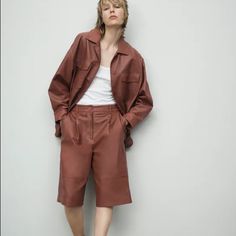 Brand New With Tags, Size Small Zara Genuine Lambskin Leather Bermuda Shorts Color: Reddish-Brown, Like Redwood Front Button And Zip Closure 100% Lambskin Shell With A Polyester Lining Zara Art: 0199 023 172 Zara Brown Shorts For Spring, Zara Brown Shorts, Zara Dark Wash Cotton Shorts, Leather Bermuda Shorts, Zara Brown Full-length Bottoms, Zara Cotton Shorts With Built-in Shorts, Zara Pants, Reddish Brown, Leather Shorts