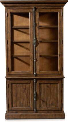 an old fashioned wooden bookcase with glass doors and metal pipes on the bottom shelf