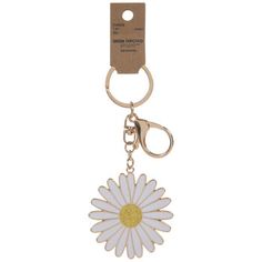 a keychain with a flower on it and a tag hanging from the front