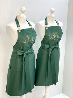 two green aprons with the words floree on them