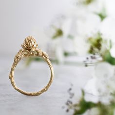 "FREE SHIPPING WORLDWIDE. Hand sculpture in stunning details, this 14K gold filled ring features a succulent inspired by the artichoke family. The intricate details on the ring are a homage to the beauty that surrounds us, that sometimes escapes our eye. So unique and ONE OF A KIND - this fabulous ring is perfect as a gift for a nature lover. DETAILS: Material: Gold Filled Ring width is about 0.007\" (0.2 mm). Height of plant from finger - 0.4\" (1 cm). Width of leaves - 0.03\" (0.8 mm). Diamete Handmade Gold Flower Ring Nature-inspired, Handmade Gold Flower Ring, Nature-inspired, Recycled Gold Nature-inspired Promise Ring, Nature-inspired Recycled Gold Promise Ring, Handmade Nature-inspired Yellow Gold Rings, Nature-inspired Yellow Gold Ring Jewelry, Nature-inspired Brass Jewelry For Anniversary, Nature-inspired Recycled Gold Wedding Jewelry, Unique Yellow Gold Flower Ring For Wedding