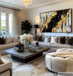 a living room filled with lots of furniture and a large painting above the couches