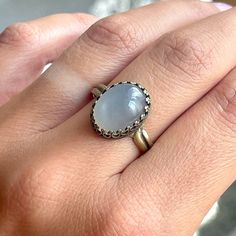 Elegant distinctive vintage ring in bronze with a very pretty Natural Grey Moonstone in a filigree oval bed. The ring has an antique look. The ring is made of Brass in bronze color, adjustable, fits every finger circumference. The basic size is 56 (US 7.5). Nice small cute Gift box and also small Jewelry Gift is included. oooooooo          ... UNIQUE JEWELRY FOR UNIQUE WOMAN ... oooooooo Details: oº Adjustable size: Basic size is 56 mm, US 7.5 oº Semi-precious gemstone - Natural Grey Moonstone o Antique Gold Moonstone Ring Oval Cabochon, Elegant Brass Moonstone Ring, Vintage Oval Crystal Ring With Natural Stones, Antique Oval Cabochon Moonstone Ring, Vintage Oval Cabochon Moonstone Ring, Antique Moonstone Oval Cabochon Ring, Antique Moonstone Ring, Oval Cabochon, Vintage Moonstone Oval Cabochon Ring, Antique Gold Moonstone Ring With Oval Cabochon