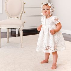 Handmade in the USA The Rose Christening dress is picture perfect! Made with a lovely light ivory lace in a pattern of delicate tea roses and leaves over a super soft cotton lining and trimmed with silk satin ribbon, to ensure she is as happy and comfortable as she is beautiful! A soft white cotton lining skirt with a romper underneath made in a natural cotton gauze with snaps for easy changes! Secured on the back with pearl buttons and a silk ribbon sash for an easy fit. Designed to fall betwee Fitted Cotton Baptism Dress With Lace Trim, Lace Baptism Dress With Lace Trim, Pink Lace Baptism Dress With Lace Trim, White Lace Trim Baptism Dress For Babies, White Organza Baptism Dress With Lace Trim, Flower Crown Headband, Christening Dress, Rose Lace, Create Outfits