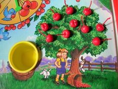 a child's play area with an apple tree