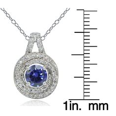 Wear the look of luxury and enjoy the vintage of elegance with this breathtaking 100 facets cubic zirconia necklace. The 100 facets transform the ordinary cubic zirconia stone into a brilliant jewel. This love knot necklace showcases a round blue violet CZ stone surrounded by smaller cubic zirconia stones and is crafted of platinum plated sterling silver. The total carat weight is 1.15ct. Product Details Metal Type sterling-silver Metal Stamp 925-sterling Weight 3.2GR Length 18IN Width 18.7MM He Cubic Zirconia Necklace With Center Stone For Gift, Formal Cubic Zirconia Birthstone Diamond Necklace, Elegant Cubic Zirconia Necklace With Center Stone, Sapphire Necklace With Diamond Cut Cubic Zirconia, Dazzling Sapphire Color Cubic Zirconia Necklace, Blue Cubic Zirconia Necklace In Round Cut, Dazzling Sapphire Cubic Zirconia Necklace, Blue Cubic Zirconia Necklace With Accent Stones, Blue Cubic Zirconia Round Cut Necklace