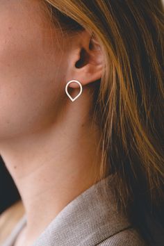 "This beautiful and minimal open teardrop stud earrings are handmade of 925 sterling silver square wire and has been brushed to a matte finish for a finer look. Those simple raindrop earrings are small, elegant and perfect for everyday wear! Measurements: ● Length: 1.5 cm / 0.4\" Width: 1.3 cm / 0.4\" Want to see more jewelry from my shop? click here: http://etsy.me/2uPuv0x Find more earrings here: http://etsy.me/2tW4sYr Find matching rings here: http://etsy.me/2u40p9h ● Item will be shipped bea Modern Teardrop Wrap Earring (single), Modern Teardrop Wrap Earring, Modern Teardrop Single Wrap Earring, Modern Everyday Teardrop Pierced Earrings, Minimalist Hypoallergenic Teardrop Jewelry, Hypoallergenic Minimalist Teardrop Jewelry, Silver Teardrop Wrap Earrings, Minimalist Teardrop Earrings With Matching Jewelry, Everyday Silver Minimalist Teardrop Earrings