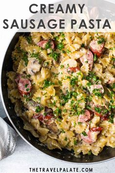 creamy sausage pasta in a skillet with text overlay