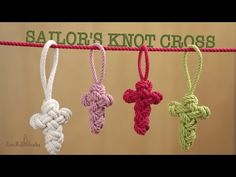 four crocheted crosses hanging on a rope with the words sailors knott cross