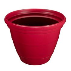 a red plastic flower pot on a white background