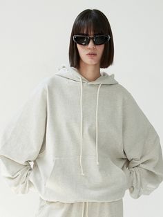 Editor's NoteThis product, with its minimalist yet fashionable design, is a testament to modern streetwear aesthetics. The oversized fit and drop shoulder styling ensures both comfort and a chic silhouette. Its kangaroo pocket and adjustable drawstring hood provide functionality while upholding the contemporary feel.- This hoodie stands out for its clean and stylish design, perfectly blending form and function.- Wearers will appreciate the comfortable and modern appeal lent by the loose-fitting Spring Drop Shoulder Hoodie With Drawstring Hood, Spring Drawstring Hood Drop Shoulder Sweatshirt, Spring Hoodie With Drop Shoulder And Ribbed Cuffs, Modern Cotton Sweatshirt With Drawstring Hood, Relaxed Fit Solid Sweatshirt With Kangaroo Pocket, Solid Color Sweatshirt With Pockets And Relaxed Fit, Solid Color Hoodie With Side Pockets And Relaxed Fit, Relaxed Fit Solid Hoodie With Side Pockets, Relaxed Fit Hoodie With Side Pockets For Everyday