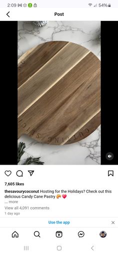 a wooden cutting board sitting on top of a white marble counter next to an instagram post