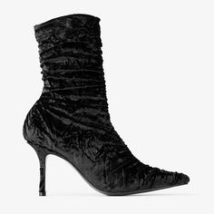 The Lotta ankle boot brings classic glamour to the modern sock boot silhouette in crushed velvet. It is designed with a pointed toe and crafted from a stretch fabric to ensure a perfect fit. Bridal Flat Sandals, Sock Boot, Boot Silhouette, Bridal Boots, Velvet Ankle Boots, Classic Glamour, Velvet Shoes, Velvet Heels, Sneaker Dress Shoes