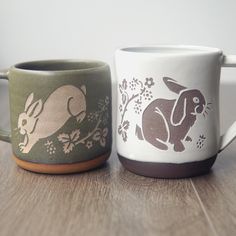 These little trickster rabbits are hanging out in their briar patch, nibbling on blackberries all day long. Their energy is abundant and fertile. Share these bunnies with someone who needs a little extra luck! Each of our handmade mugs is lovingly wheel thrown from brown clay before we sandcarve our original graphics into the glaze layer. Glaze colors and textures may vary from what's shown, as each batch turns out differently. These are completely handmade in the USA!   The beauty of these pott Rabbit Mug, Briar Patch, Bunny Mug, Farmhouse Mugs, Glaze Colors, Handmade Mugs, Brown Clay, Forest Style, Gifts For My Girlfriend