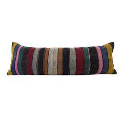 a multicolored striped pillow on a white background