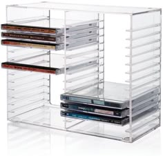 an acrylic storage rack holds several dvd's