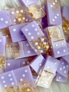 purple and white dices with gold flakes on them