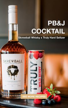 a bottle of booze next to some berries on a tray with the caption pb & j cocktail skewball whisky truly hard setter