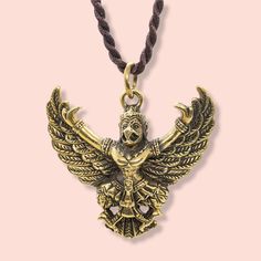 ✨A beautigul Garuda gold plated pendant, this piece is sure to make a statement.  ✨The Buddha Talisman Powerful Garuda Bird Pendant Necklace has the power to calm and protect the wearer. This is a beautiful and powerful talisman for good luck and protection. The Garuda pendant is made of brass gold-plated material and its design of the powerful Garuda bird pendant will make the difference. The Buddha Talisman is a powerful and spiritual charm that will give you protection, luck, and guidance.  ✨This Buddha pendant features a powerful Garuda Bird which is shown with its wings open and flying in an upward direction. The Garuda Bird Pendant Necklace is a beautiful pendant necklace with a powerful talisman inside. The Garuda is the powerful protector of good luck, and it is also the messenger Magic Pendant, Beautiful Pendant Necklace, Buddhist Traditions, Spiritual Symbols, Hindu Mythology, Buddha Pendant, For Good Luck, Bird Pendant, Hammered Metal