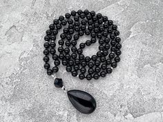 Black Necklace, Black Agate Long Necklace, 108 Mala Bead Necklace, Gift  for Man for Women, Hand Knotted Black Onyx Drop Pendant Necklace -  8mm Black Agate 108 beads -  10mm Black Onyx Guru bead -  Black Agate Pendant The necklace you see in the photo are made from 108 beads, each with a diameter of 8mm, creating a beautifully crafted piece. The length of the necklace is approximately 40 inches plus 4cm pendant.  Since I custom-make these necklaces, I can make them any length but also make alte Black Crystal Necklaces With Round Gemstone Beads, Spiritual Black Crystal Necklaces With Faceted Beads, Black Spiritual Crystal Necklace With Faceted Beads, Spiritual Black Crystal Necklace With Faceted Beads, Black Faceted Spiritual Beads, Elegant Black Jewelry With 108 Beads, Black Crystal Necklaces With Round Natural Stones, Black Onyx Round Bead Crystal Necklaces, Onyx Necklace With Black Beads For Meditation