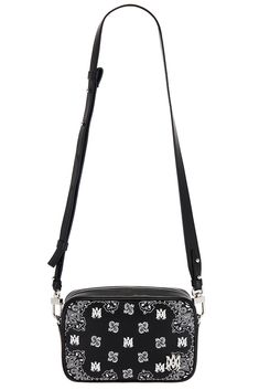 Find AMIRI Bandana Camera Case Bag on Editorialist. Amiri Bandana Camera Case Bag in Black Leather exterior with Amiri logo detail embroidered and ripstop lining. Made in Italy. Top zipper closure. One main compartment. Detachable shoulder strap. Measures approx 7.5 W x 5 H x 2 D Shoulder strap with a 16.5 drop. AMIF-MY70. AMBGCM1006. About the designer: Mike Amiri's eponymous label fuses rock and roll with haute couture. Deriving its inspiration from Amiri's upbringing in Hollywood, the Califor Leather Shoulder Bag With Embroidered Logo For Everyday Use, Leather Shoulder Bag With Embroidered Logo For Daily Use, Everyday Leather Shoulder Bag With Embroidered Logo, Leather Shoulder Bag With Embroidered Logo For Travel, Luxury Leather Shoulder Bag With Embroidered Logo, Black Shoulder Bag With Embroidered Logo For Everyday, Luxury Leather Bags With Embroidered Logo, Luxury Embroidered Logo Crossbody Bag, Travel Crossbody Shoulder Bag With Embroidered Logo