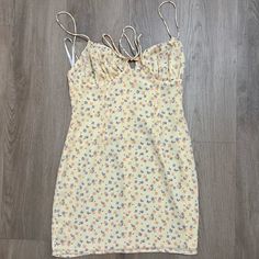 Never Worn Yellow Sundress Mini Length, Yellow Mini Dress For Spring Vacation, Yellow Fitted Mini Dress With Spaghetti Straps, Yellow Summer Mini Dress, Yellow Spaghetti Strap Mini Dress For Brunch, Yellow Mini Sundress For Vacation, Yellow Floral Print Mini Dress For Vacation, Yellow Mini Dresses For Day Out, Chic Yellow Fitted Sundress