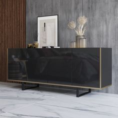 a black and gold sideboard in a room with marble flooring, vases and framed pictures on the wall