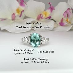 Green Aquamarine Rings For Anniversary, Green Aquamarine Ring With Center Stone, Turquoise Emerald Ring For Anniversary, Green Topaz Wedding Ring With Center Stone, Green Aquamarine Promise Ring, Green Sapphire Ring Gia Certified For Wedding, Green Topaz Ring With Accent Stones For Anniversary, Green Oval Topaz Ring For Wedding, Tourmaline Wedding Ring