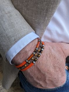 Magnificent trendy "protective" bracelet for men for a chic and casual look Composed of 3 fine bracelets, artisanal braiding with different knots made in 🇫🇷 Orange and brown braiding thread Natural tiger's eye stone, carnelian, mother-of-pearl and hematite Adjustable bracelet with sliding knot suitable for wrists from 17.5 cm to 18.9 cm maximum for size 1 (standard size) From 19 cm to 21 cm max: Size 2 (⚠️large size) Round tiger eye beads +- 4 mm Carnelian tube +- 13 x4mm Mother-of-pearl beads Masculine Jewelry, Mens Bracelet Designs, Beads Bracelet Design, Tiger Eye Beads, Protection Bracelet, Eye Beads, Men's Bracelet, Mens Beaded Bracelets, Bracelet For Men