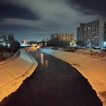 a river running through a city at night