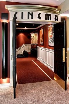 an open door leading to a room with red carpet and white trim on the walls