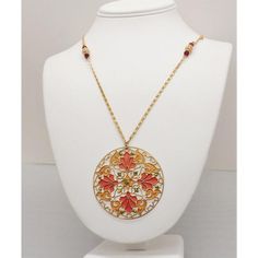 This is part of Chairish’s Costume Jewelry assortment.  1970s goldtone round orange and yellow plique-a-jour (stained glass) pendant  with faceted faux-garnet decoration on the chain necklace with spring ring clasp. Marked "Napier" on the jump ring that the clasp attaches to. Pendant measures: 2 3/16 inches across. Chain doubled measures: 14 3/4 inches long. Excellent condition. Red Enamel Round Necklace, Orange Bohemian Jewelry With Round Pendant, Red Enamel Round Pendant Necklace, Bohemian Orange Round Pendant Jewelry, Orange Bohemian Round Pendant Jewelry, Gold Enamel Medallion Necklace, Vintage Enamel Necklaces With Lobster Clasp, Bohemian Gold Enamel Necklace, Gold Bohemian Enamel Necklace