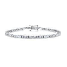 A classic look she'll love from the moment you present it to her, this sparkling tennis bracelet is more than she can imagine. Crafted in 10k white gold, this beautiful timeless line style bracelet features brilliant lab grown diamonds. The diamonds are 3ctw, H in color and VS2 in Clarity. This bracelet measures 7.25 inches in length and 2.5mm in width. REEDS exclusive ECONIC Diamonds are lab grown in a technologically advanced facility, allowing us to offer laboratory created diamonds that poss White Gold Tennis Bracelet Channel Set For Wedding, Fine Jewelry Tennis Bracelet With Channel Set For Wedding, Classic Channel Set Diamond Bracelet For Wedding, Elegant White Gold Tennis Bracelet With Channel Set, Elegant White Gold Tennis Bracelet Channel Set, Elegant Wedding Tennis Bracelet With Channel Set, Timeless Diamond Channel Set Tennis Bracelet, White Gold Diamond Tennis Bracelet - Channel Set, Classic Diamond Bracelet With Channel Set