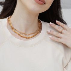 A tried and true favorite, our Colette Necklace is a simple chain link style that can be dressed up, dressed down, and worn with everything in your jewelry line-up. Available in 14k gold plated and rhodium plated brass Chain width: 5mm 16" or 18" elongated link paperclip chain with 2" extender Lobster claw closure Made in the USA SKU: BYN1185 Classy Choker, Simple Gold Chain, Gold Chain Necklaces, Simple Chain Necklace, Stackable Necklaces, Two Necklaces, Simple Chain, Layered Necklace Set, Wrap Necklaces