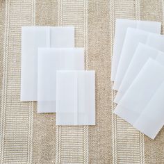 several pieces of white fabric laid out on a table