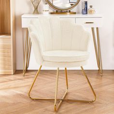 a white chair sitting in front of a mirror on top of a wooden floor next to a dresser