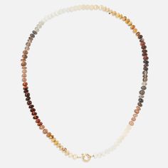 The Encirkled Coffee Gemstone Beaded Necklace is our favorite way to wear neutrals in beautiful amber and chocolate hues- the ultimate addition to your neck stack. This piece includes assorted gemstones featuring a 14k spring ring closure, that is perfect for displaying your favorite charms. 8mm assorted gemstones that may include agate, amber, aventurine, chocolate moonstone, hessonite, goldstone, jasper, peach moonstone, pearl, Peruvian opal, rainbow moonstone, red tiger's eye, smoky quartz, t Charm Display, Neck Stack, Red Tigers Eye, Peruvian Opal, Gemstone Beaded Necklace, Peach Moonstone, Unique Gemstones, Tiger's Eye, Smoky Quartz